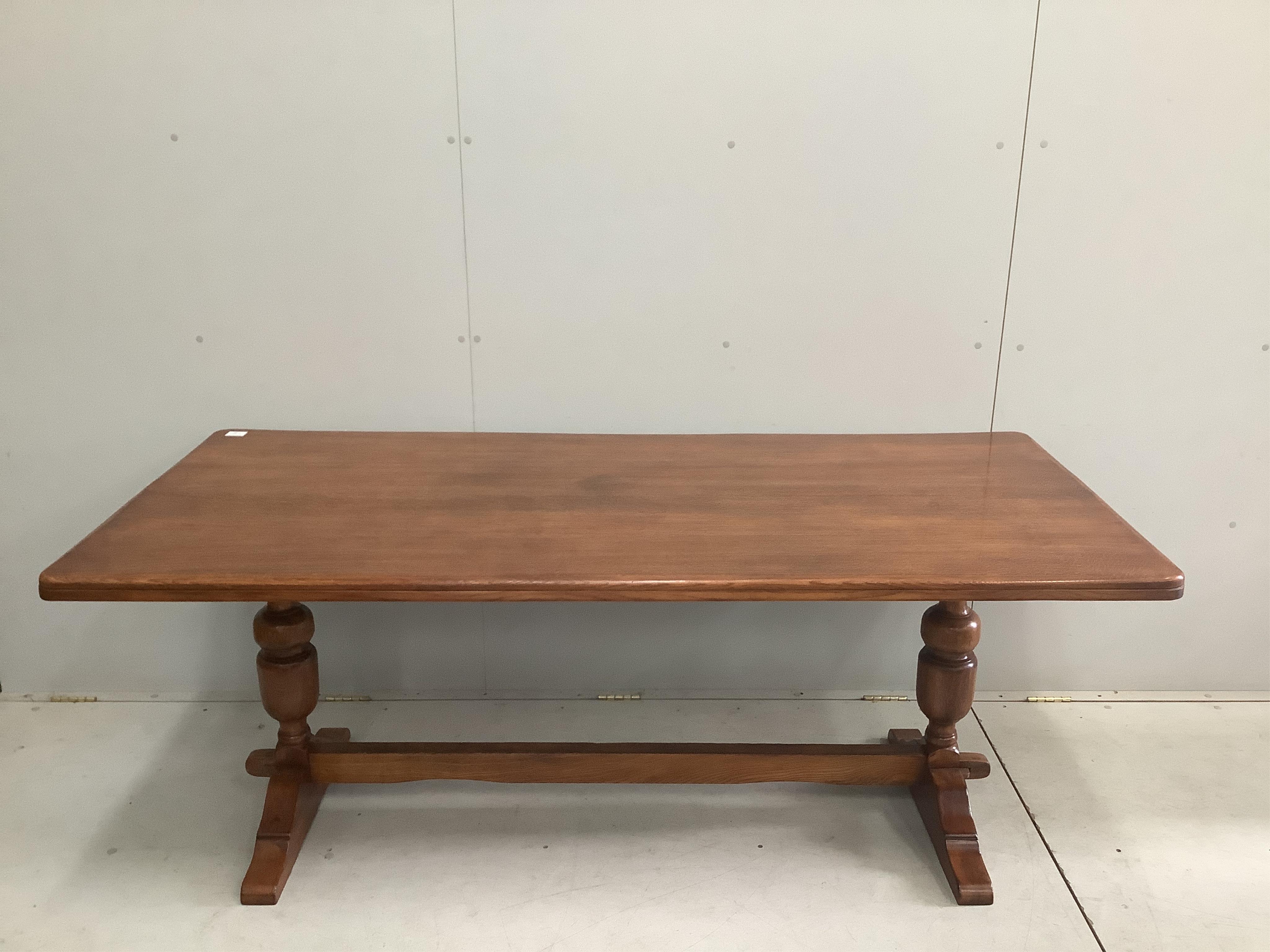 An 18th century style rectangular oak refectory dining table, width 182cm, depth 83cm, height 71cm together with six early 20th century oak dining chairs